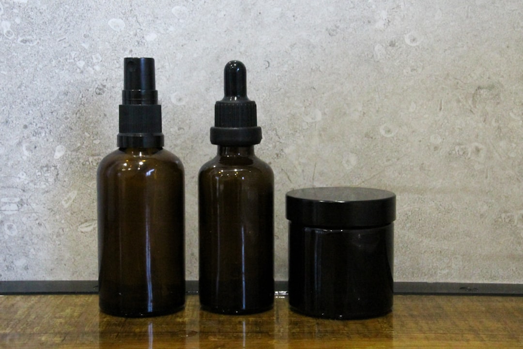 amber glass tincture bottles on wooden table — er chen tang herbal formula