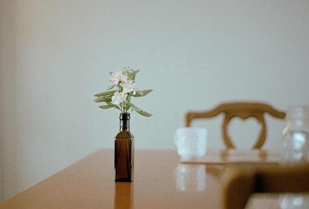herbal tincture bottle dropper on wooden table