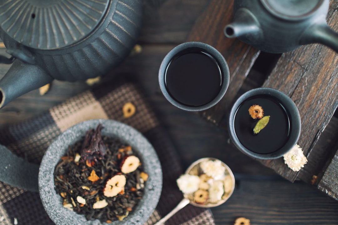 Dried herbs used in classical chinese immune formulas, laid out on a wooden surface.