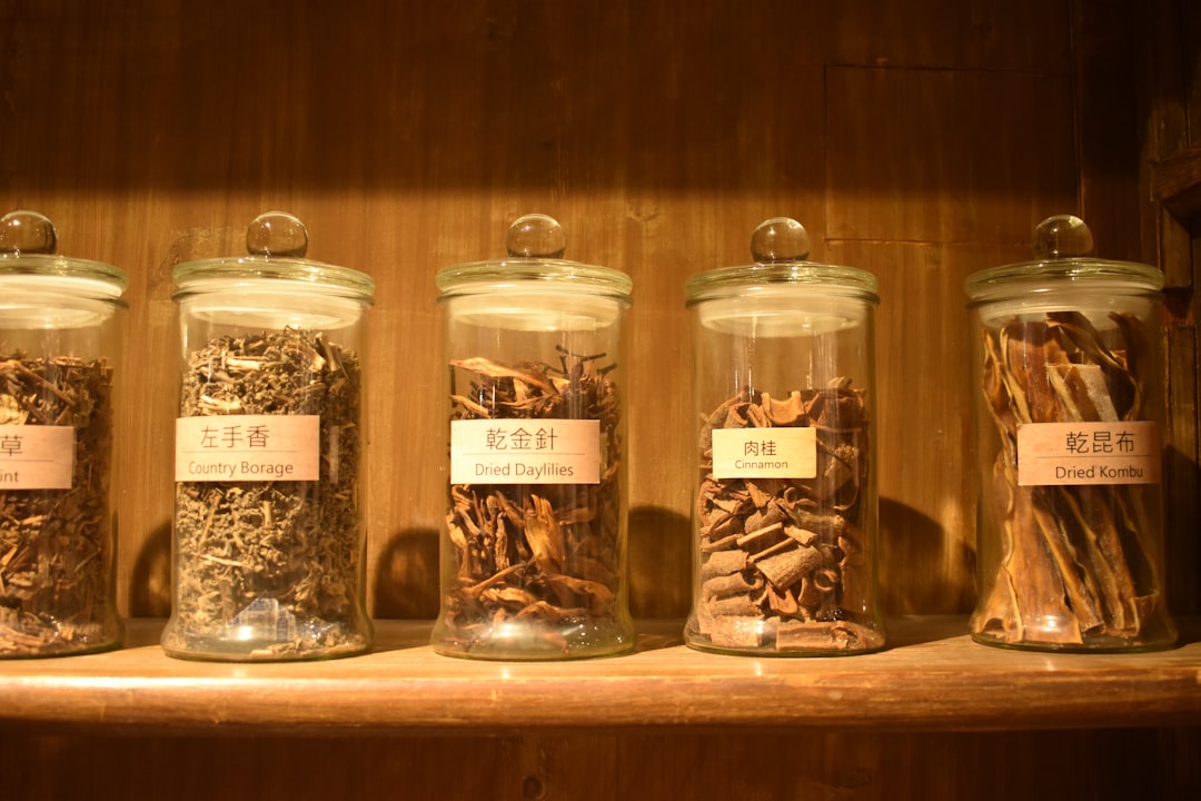 Dried herbs in jars — preparing a classical TCM tincture formula