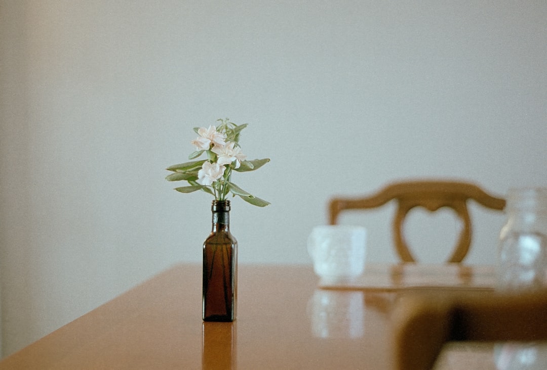 Amber glass yarrow tincture bottle on a wooden table