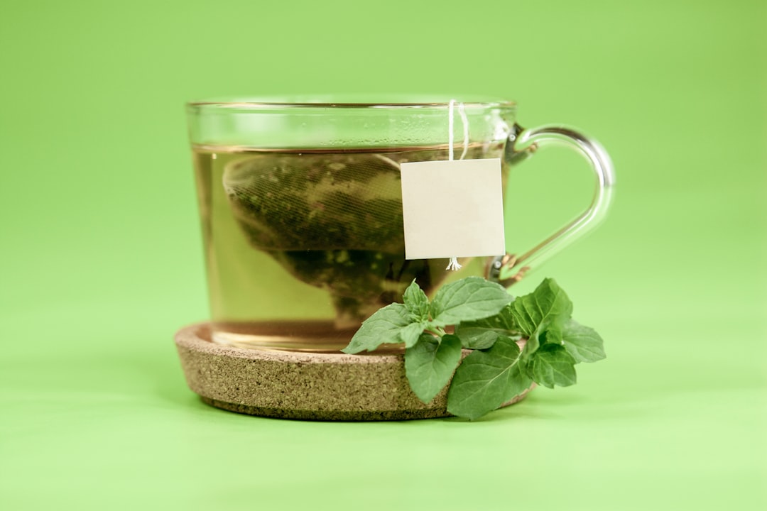 Loose dried herb steeping in a glass cup, one way blue vervain is prepared