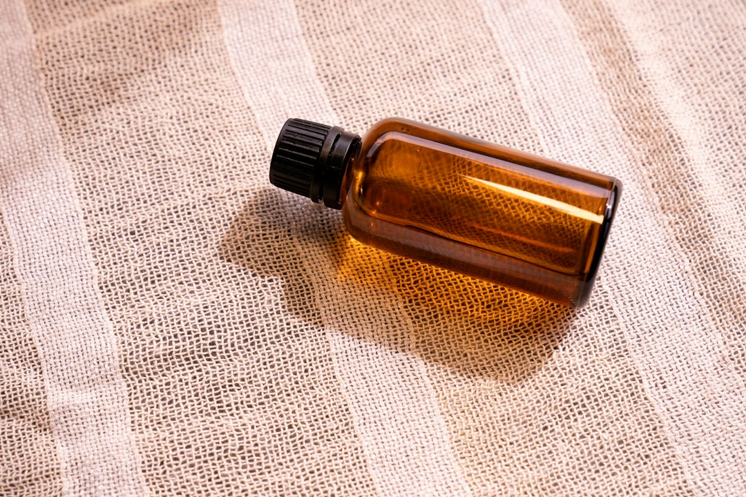 Amber bottle of rhodiola tincture on linen cloth