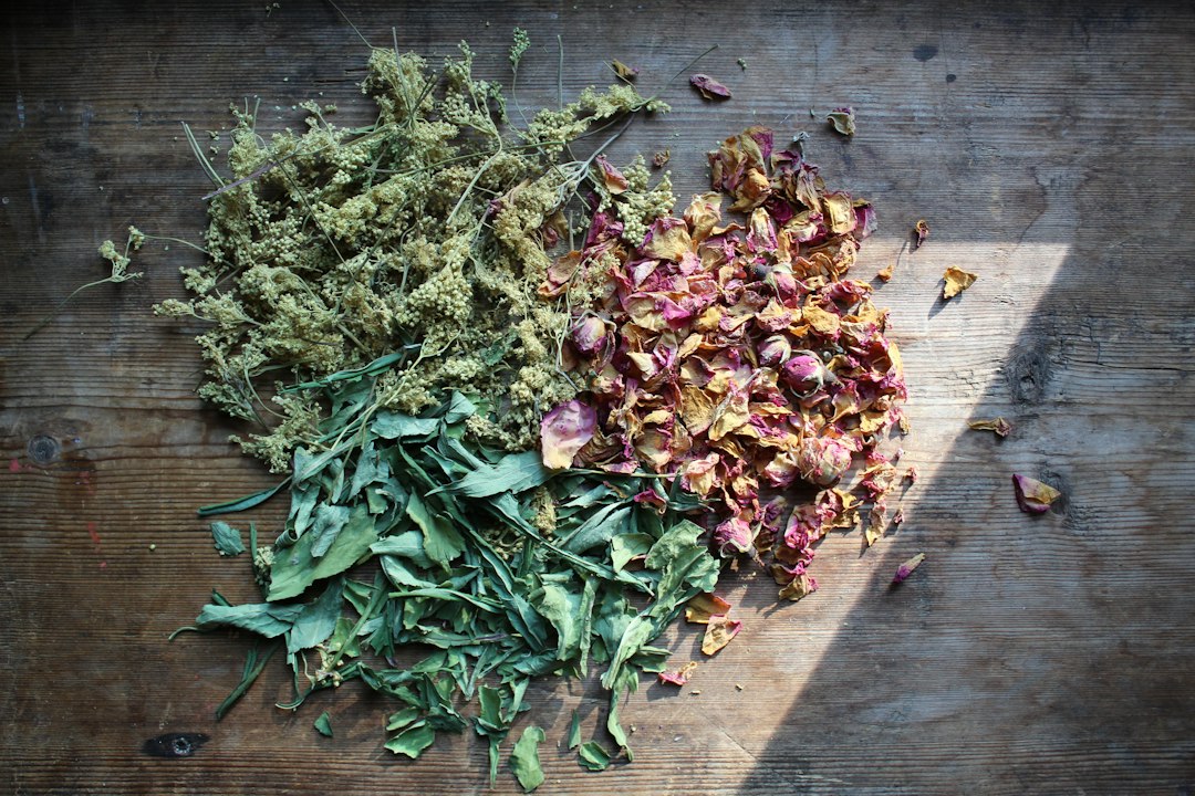 Dried herbs and flowers on a wooden table